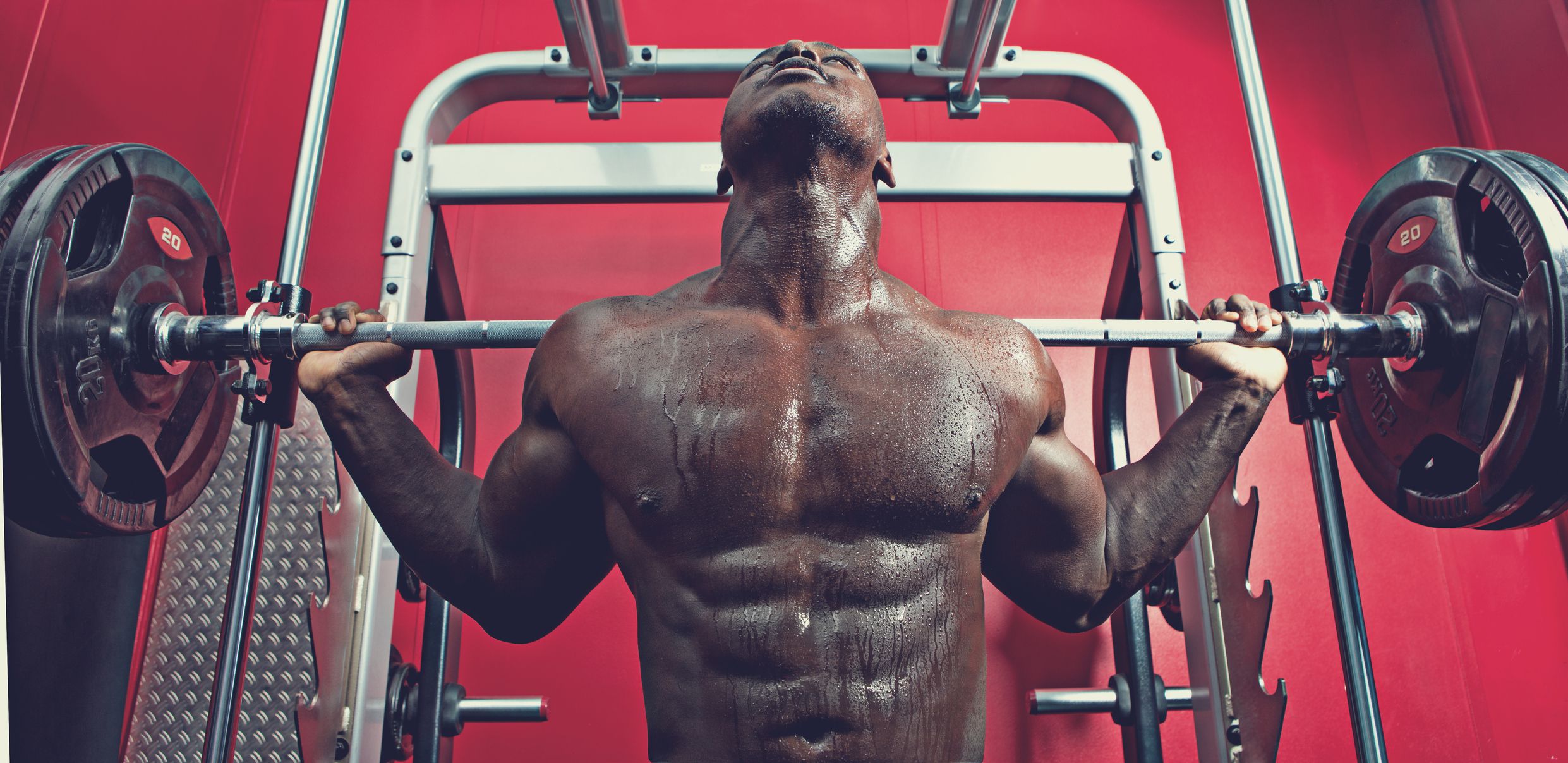 black athlete working out at a gym