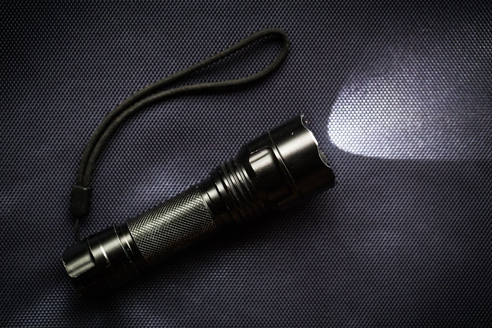 LED flashlight with a light beam for hiking at night