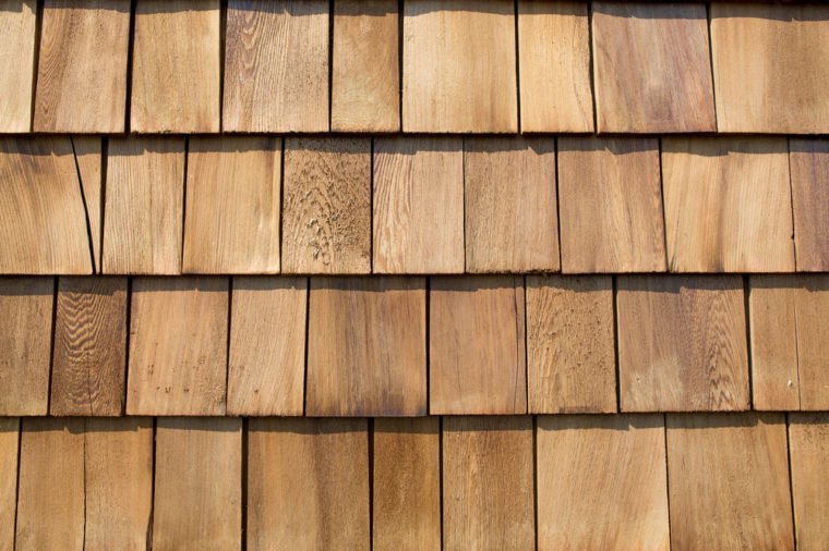 Close up of brown wood roof shingles.