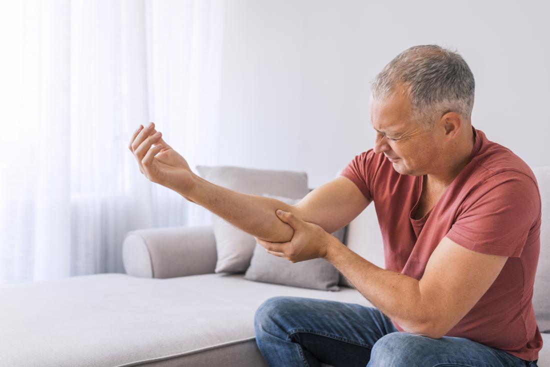 man with severe pain in his right elbow