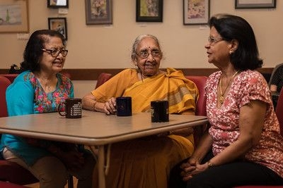 women talking over coffee