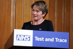 woman standing at lectern