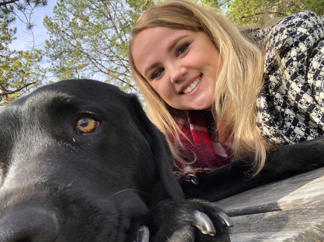 Beth Deer poses with her guide dog Patronus trained by Guide Dogs for the Blind
