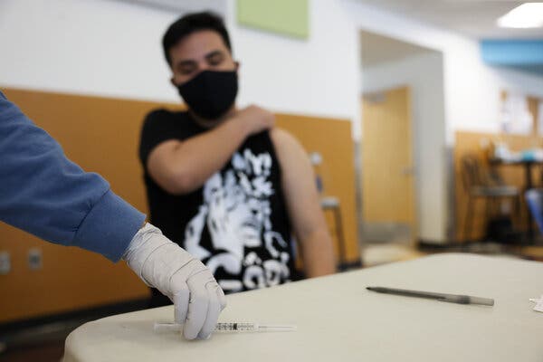 Covid shots being administered by a health program in Denver that works with schools  to vaccinate older teenagers — and soon, younger ones — at health clinics it runs in six public schools. 